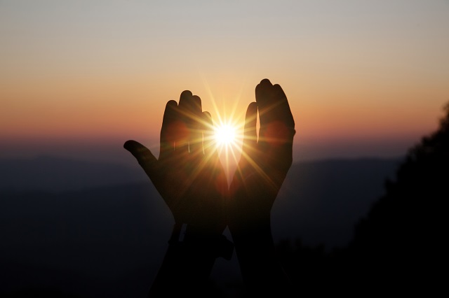 YSCFaith of christian concept: Spiritual prayer hands over sun shin